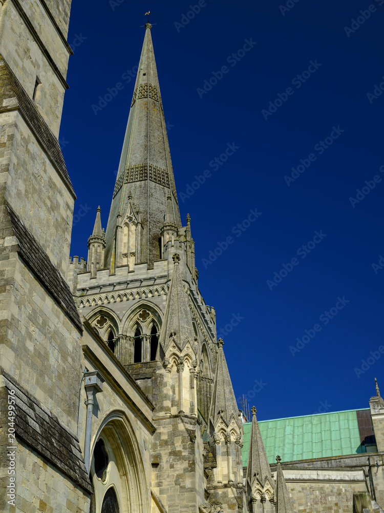 Spring afternoon sunshine on Chichester cathedral from Bishop's Palace Gardens, Chichester, West Sussex, UK