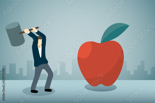 Businessman breaking big apple with hammer.
