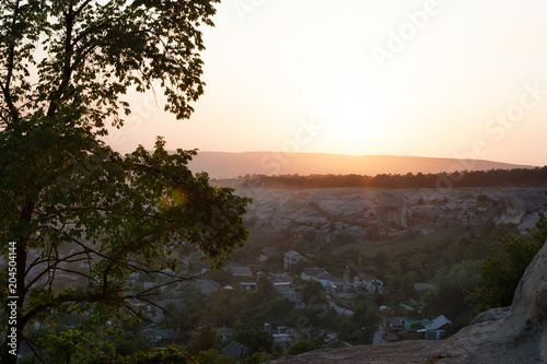 View of a small mountain village in the setting sun