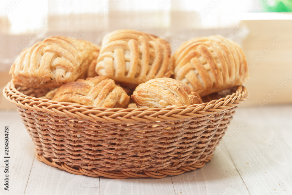 Cookies and sweet pastries with cross wired lines in basket Cookies and sweet pastries with cross wired lines in basket
