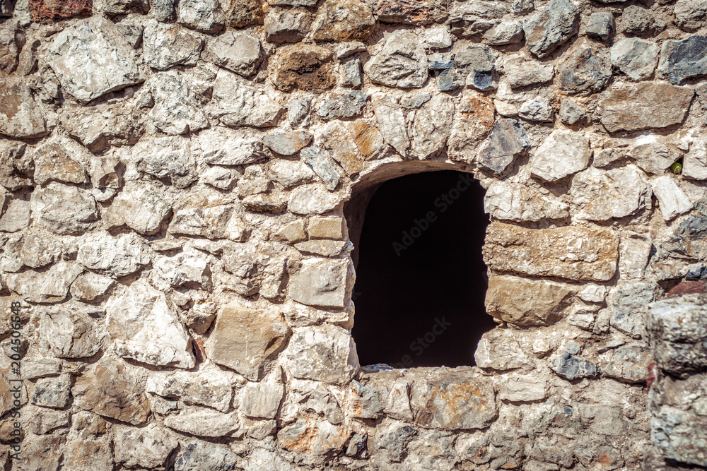 Stone wall and window of castle 