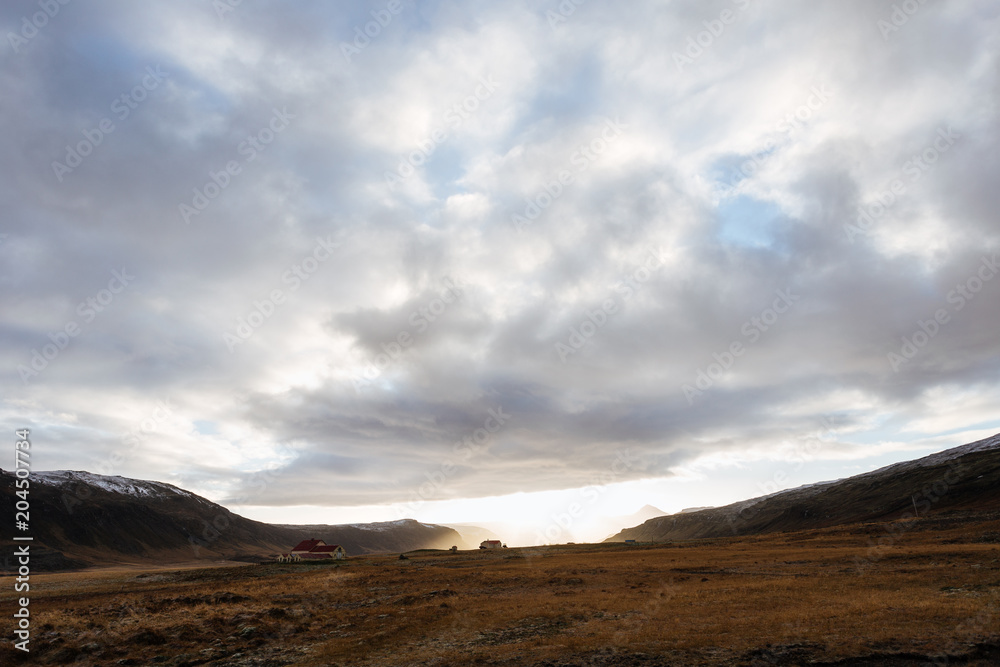 Mountain road leading to the peaks in Iceland.