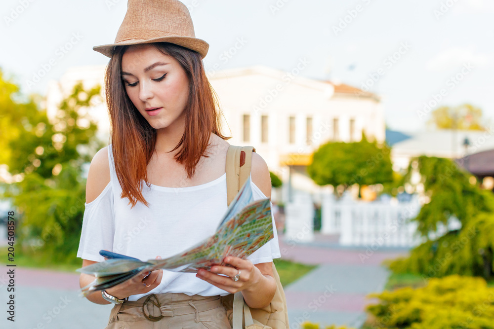 travel guide, tourism in Europe, woman tourist with map on the street