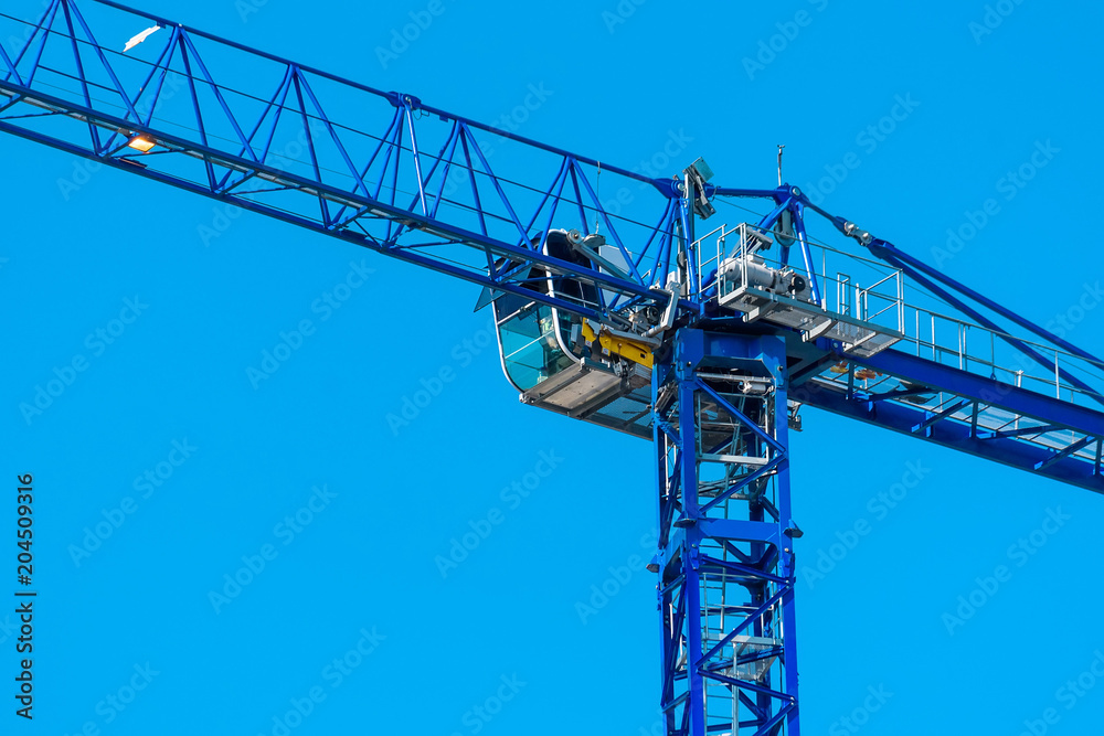 Construction crane builds new building