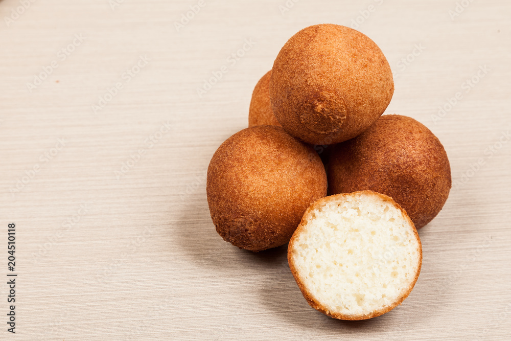 Delicious buñuelos, Colombian cuisine. buñuelos made with flour and cheese. Delicious buñuelos, Colombian cuisine. buñuelos made with flour and cheese.
