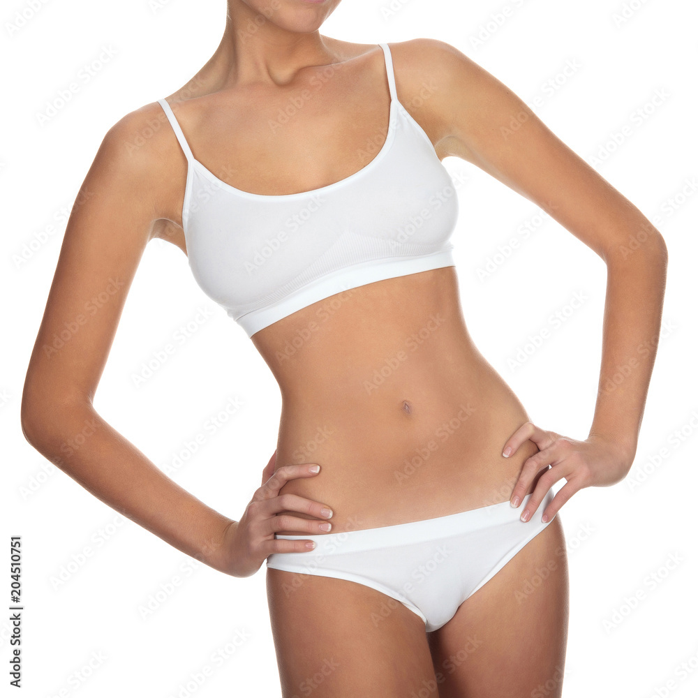Closeup shot of slim female body against a white background, isolated Closeup shot of slim female body against a white background, isolated