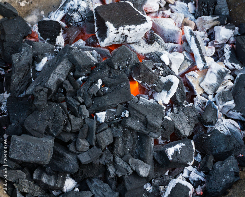 Barbecue hot charcoal burning at start of BBQ.