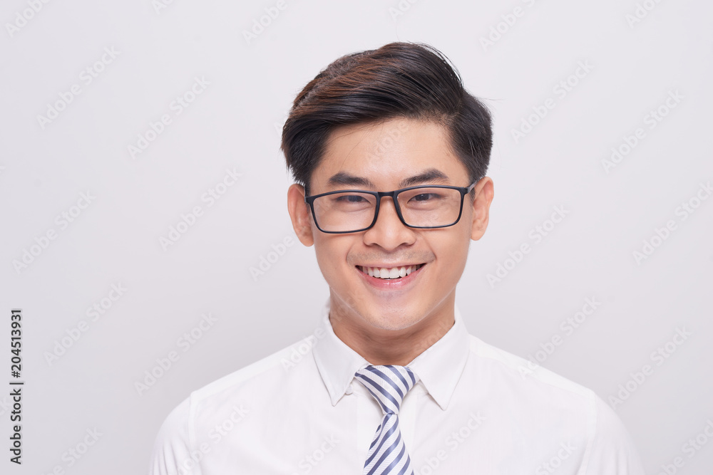 Handsome young asian business man smiling