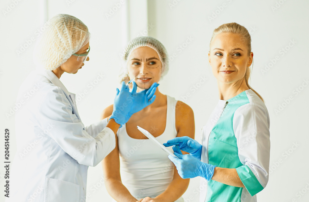 Permanent Makeup For Eyebrows. Beautiful Woman With Thick Brows In Beauty Salon. Beautician Doing Eyebrow Tattooing For Female Face. Beauty Procedure, selective focus Permanent Makeup For Eyebrows. Beautiful Woman With Thick Brows In Beauty Salon. Beautician Doing Eyebrow Tattooing For Female Face. Beauty Procedure, selective focus