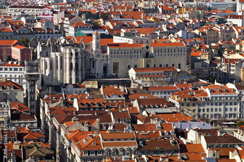 Carmo Convent ruins, Santa Justa lift or Elevator and orange rooftops of the historical Baixa District of Lisbon, Portugal.