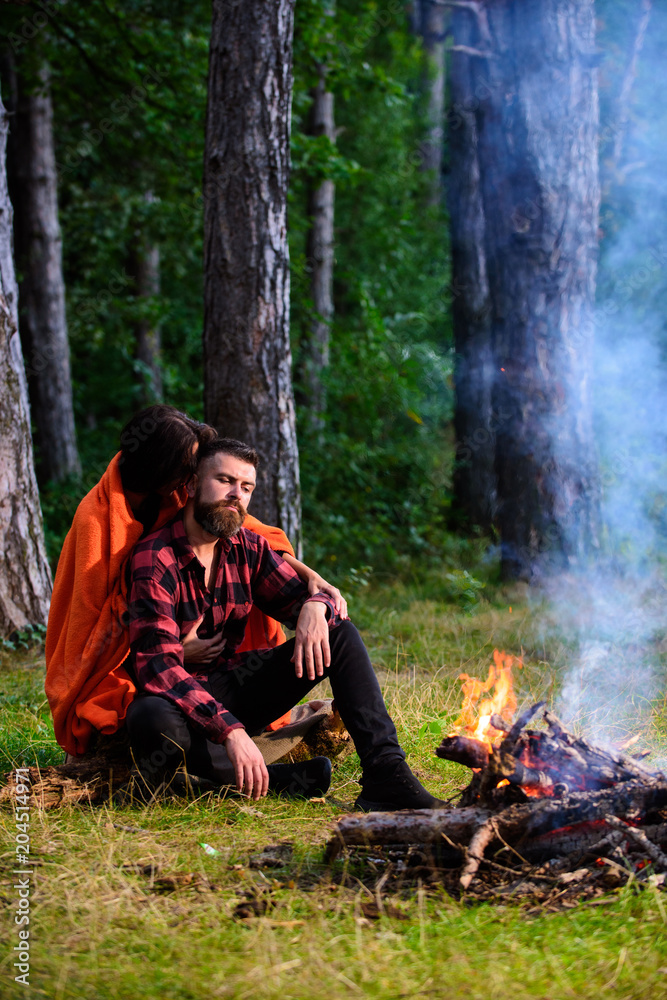 Young couple with tired faces covered with plaid. Young couple with tired faces covered with plaid.