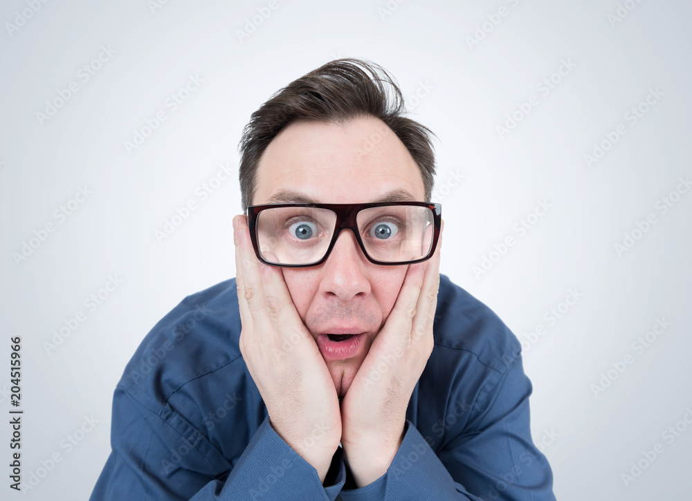 Man in glasses feels a strong fear, concept of crisis Man in glasses feels a strong fear, concept of crisis