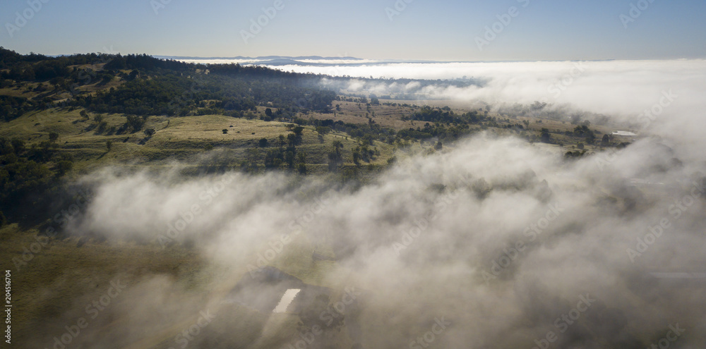 Obraz premium Aerial drone view of a foggy morning in the Scenic Rim, Queensland, Australia