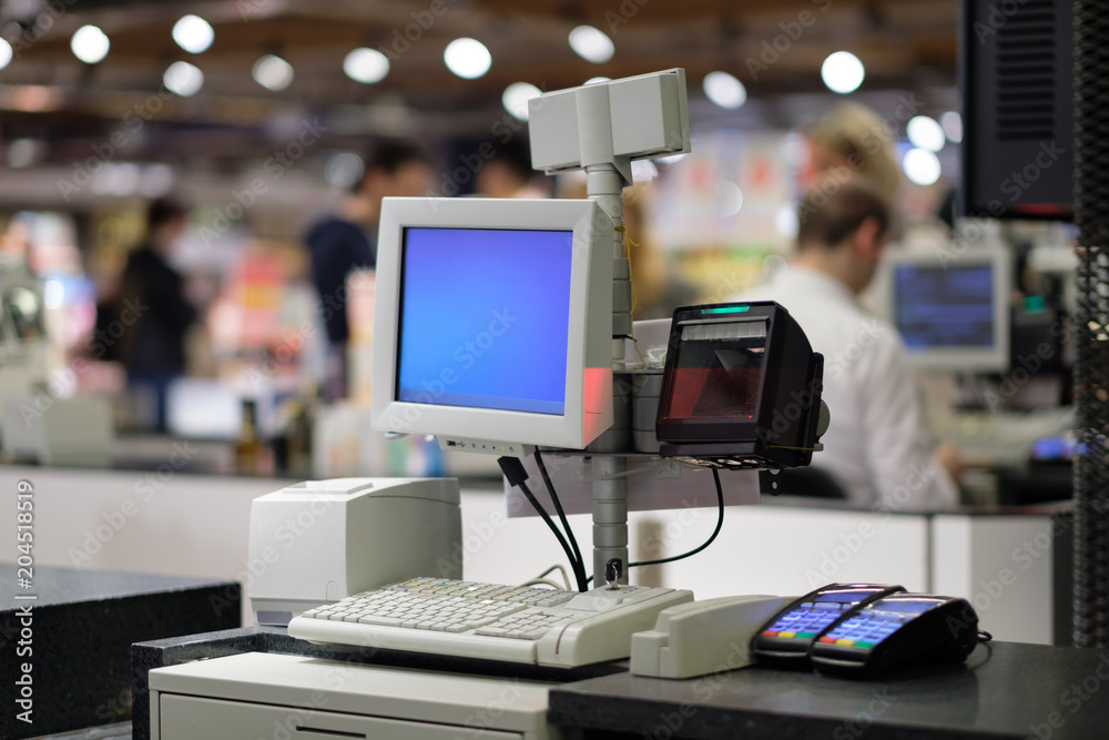 Rows of cash desks with cashiers and customers on blurry background Rows of cash desks with cashiers and customers on blurry background