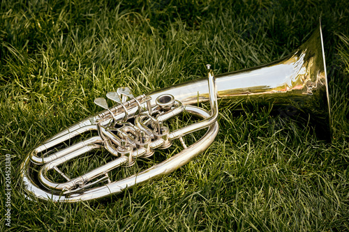 Closeup of a musical wind instrument orchestra of silver trumpets.