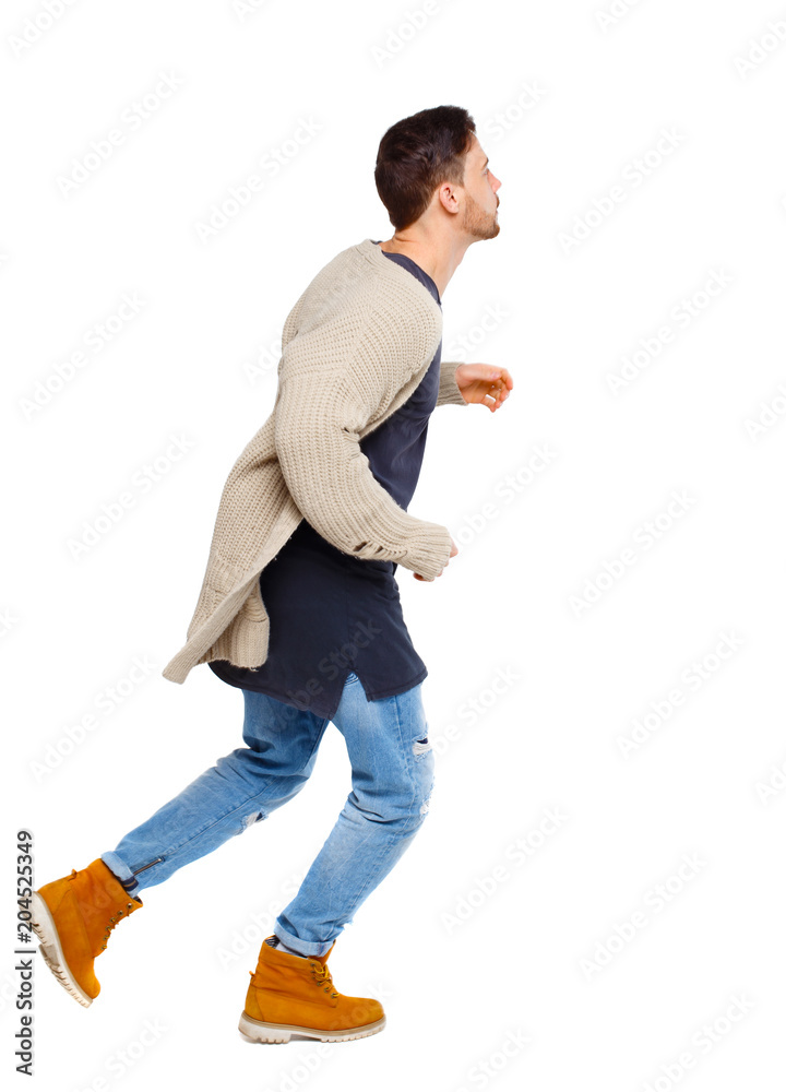 Naklejka premium Side view of a running man in sweater.