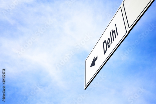 Signboard pointing towards Delhi