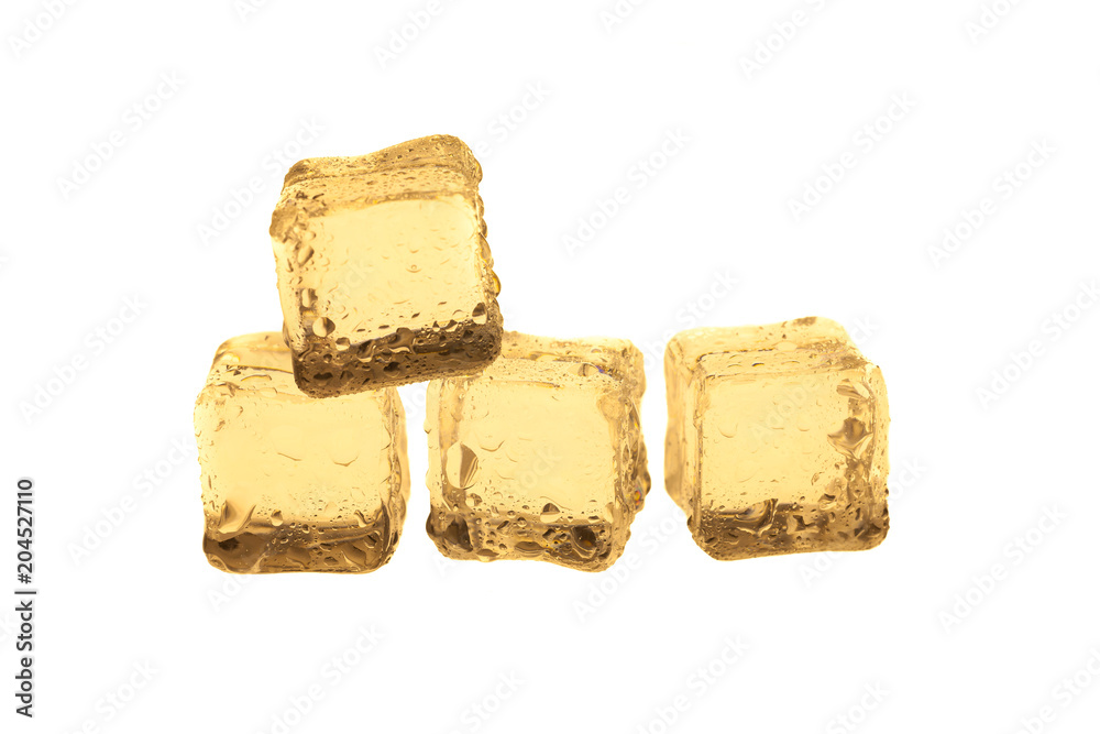 Golden ice cubes on white background. Golden ice cubes on white background.