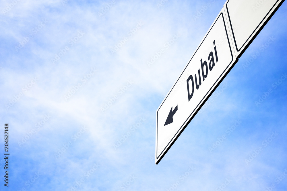 Signboard pointing towards Dubai