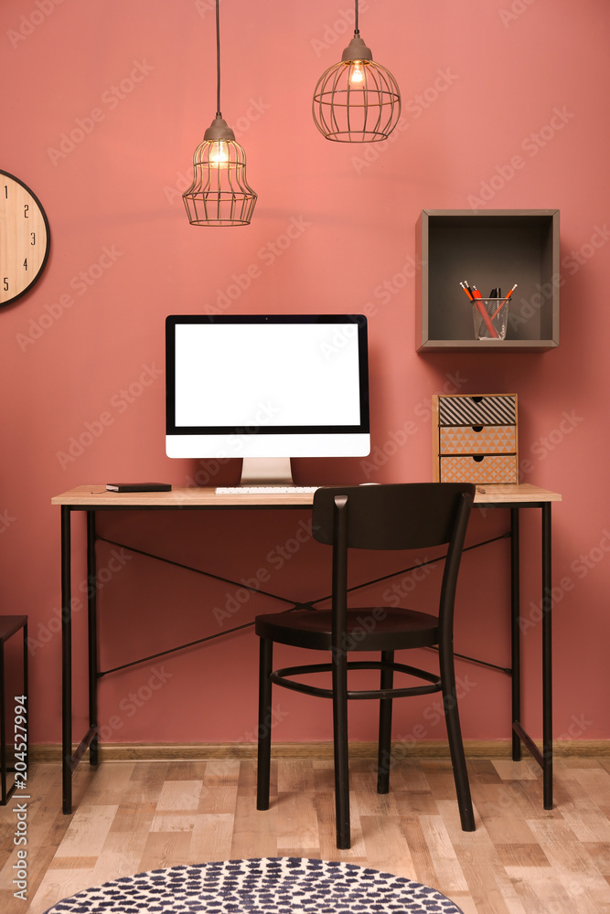 Comfortable workplace with computer on desk in home office Comfortable workplace with computer on desk in home office