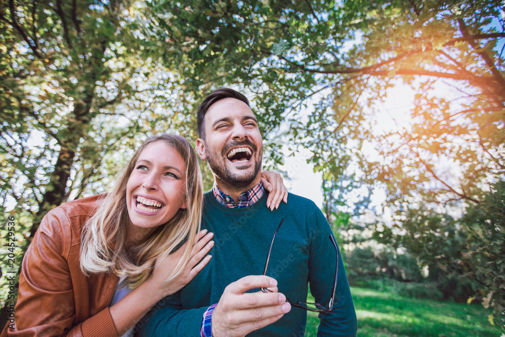 Fototapeta premium Happy couple in love having fun outdoors and smiling.