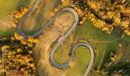 Aerial landscape - windy road in autumn scenery
