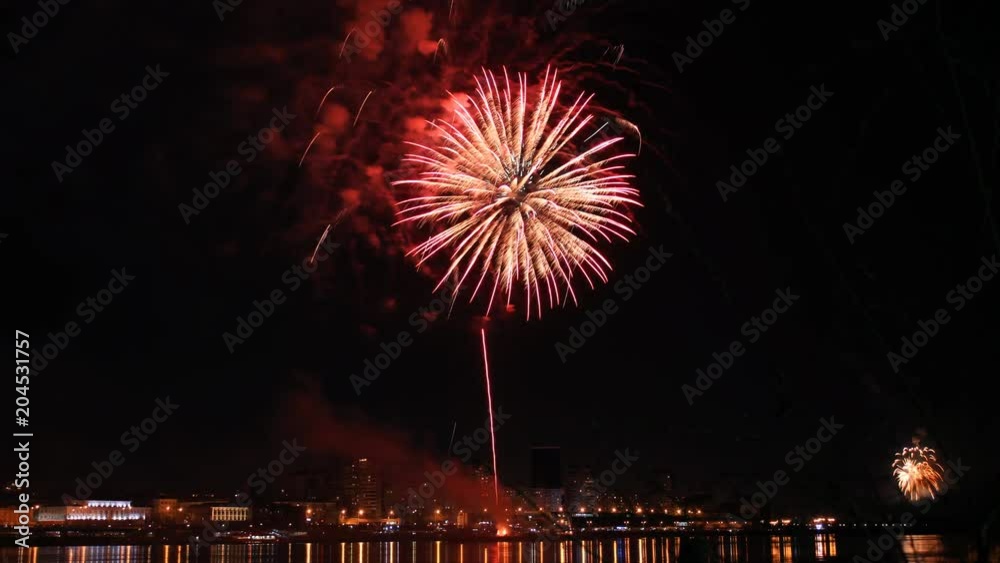 Time lapse of a beautiful fireworks display at the city festival over the river. Time lapse of a beautiful fireworks display at the city festival over the river.