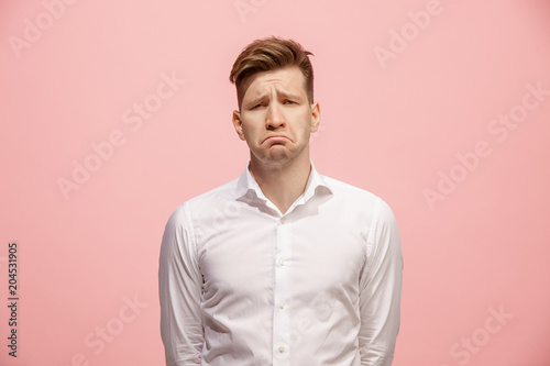 Beautiful bored man isolated on pink background © master1305