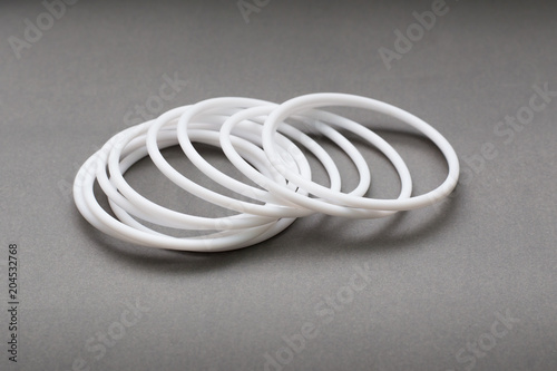 Teflon ring seals on gray background photo