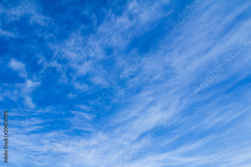 light blue sky background with white clouds