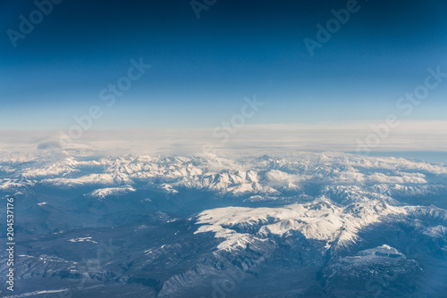 Mountain range in Caucasus mountains with snowy tops.