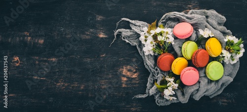 Macaroons colorful. Cake. Top view On a wooden background  Copy space.