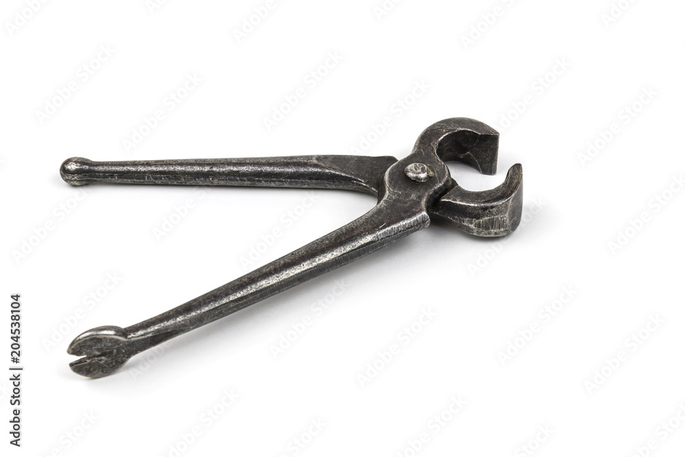 Old used iron nippers, for pulling and biting off nails and cutting metal close-up. Isolated on white background. Old used iron nippers, for pulling and biting off nails and cutting metal close-up. Isolated on white background.