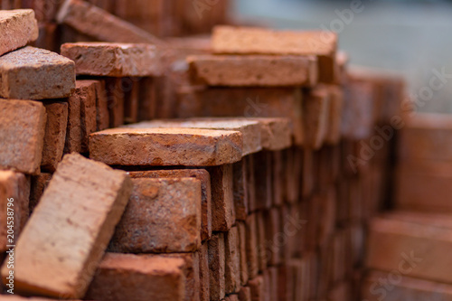 Red bricks on building. On blurred background