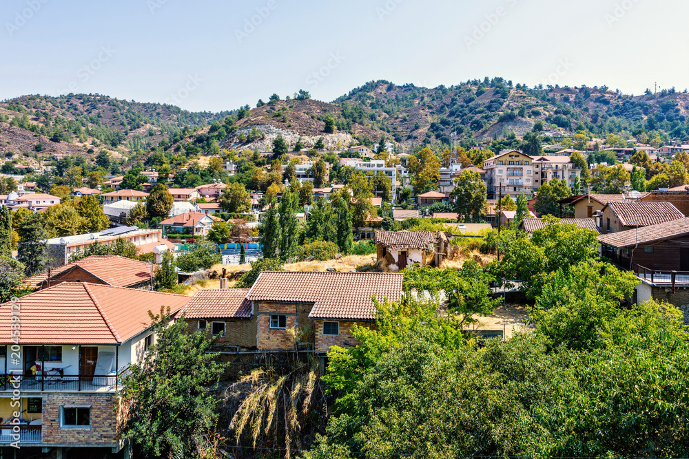 Daylight view from above to city buildings and Troodos Mountains