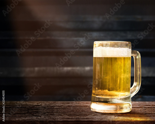 Glass of Beer on Wooden Table in Pub or Restaurant