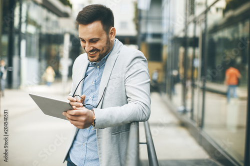 Young businessman with digi...