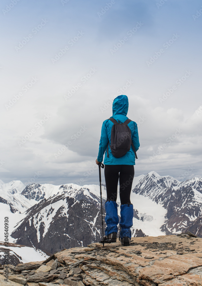 happy woman standing in mountain
