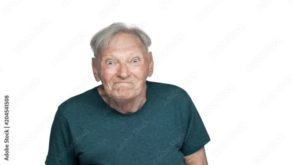 Portrait of happy grandfather 80s having gray hair in basic t-shirt rejoicing and clenching fists like winner, isolated over white background Portrait of happy grandfather 80s having gray hair in basic t-shirt rejoicing and clenching fists like winner, isolated over white background