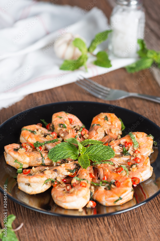 Stir-fried Shrimp with pepper and garlic on black plate. Stir-fried Shrimp with pepper and garlic on black plate.