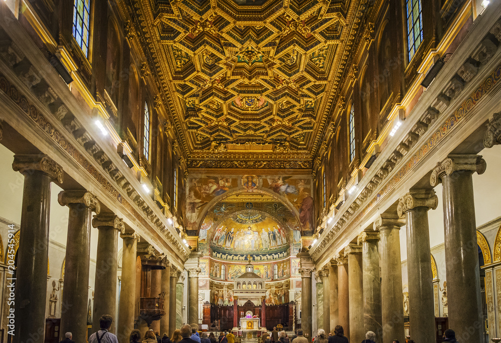 rich baroque ceiling in Santa Maria in Trastevere church interior in Rome