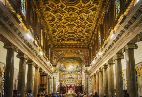 rich baroque ceiling in Santa Maria in Trastevere church interior in Rome