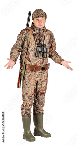 Full length portrait of a male hunter with double barreled shotgun Isolated on white background. hunting and people concept