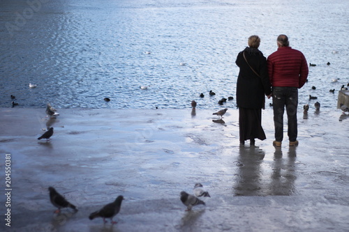 Lovers watching the sea at sunset