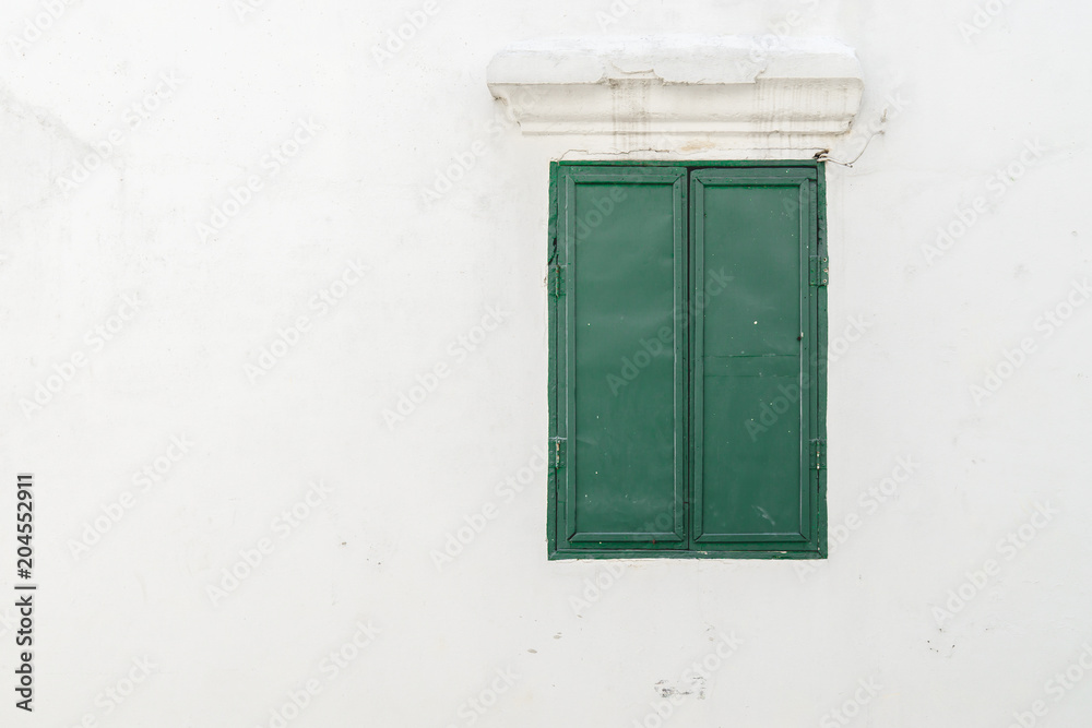 Old green window on the wall., with copy space for text.