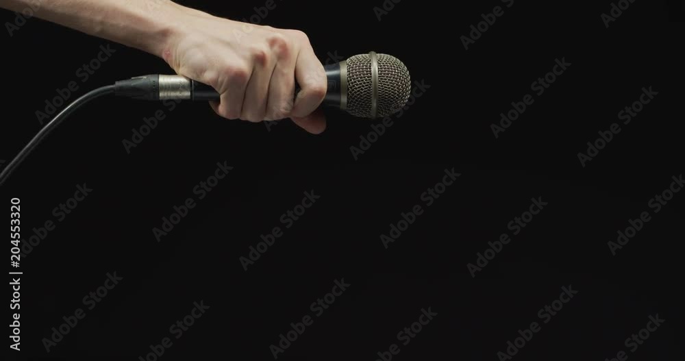 Hand dropping a microphone