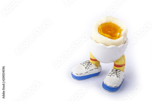 boiled egg open half with legs isolate