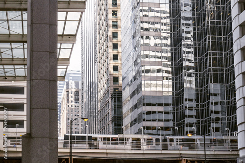 metro station on the bridge in downtown Chicago surrounded by skyscrapers. Vintage tinted