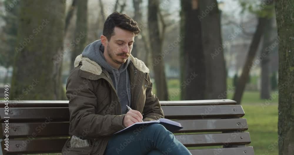 Rewrite men. Writing Park. Writer in a Park.