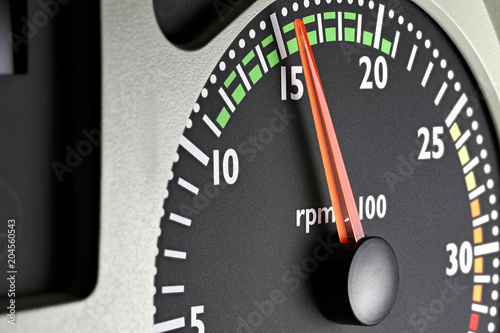 tachometer of a truck at economic mode of operation photo